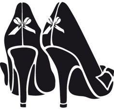 two high heeled shoes with bows on them