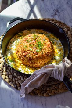 a pan filled with food sitting on top of a table