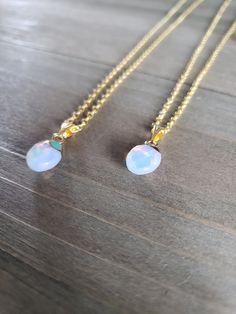 Beautiful white and iridescent opal stone necklace with petite resin pendants on elegant gold plated chain. Brilliantly colorful opaque opal pendants, elegant rainbow colors, and paired with 18 karat gold plated stainless steel necklace chain. Colorful hues mingle together to create this naturally stunning stone jewelry piece. ♡ Made with 18 karat gold plated stainless steel necklace chain at 18 inches of length. Boldly colorful resin jewelry ♥ Be sure to check out the NECKLACE section at Earrin White Opal Necklace With Delicate Chain, Gold Opal Teardrop Pendant Necklace, Iridescent Opal Necklaces For Gift, Gold Teardrop Opal Necklace, Iridescent Opal Necklace Perfect For Gifts, Iridescent Opal Necklace For Gift, Gold Ethiopian Opal Pendant Necklaces, Gold Ethiopian Opal Pendant Necklace, Gold Opal Teardrop Necklace