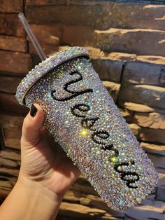 someone is holding up a glitter case with the word god on it and sparkles in the background