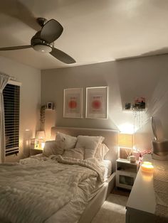 a bedroom with a bed, desk and ceiling fan