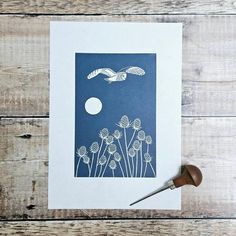 a card with an image of a bird flying over dandelions and the moon