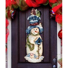 a snowman is standing in front of a door