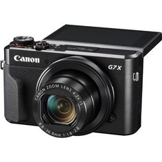 the canon g7x digital camera is shown with its lens pointed at the viewer