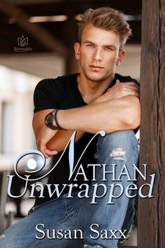 a man sitting on top of a wooden pole next to a sign that says nathan unwrapped