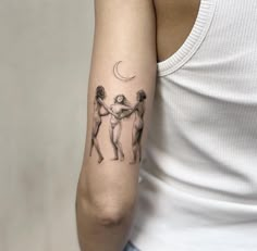 a woman with a tattoo on her arm is holding onto another person's arm