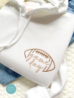 Game day Football Shirt, Embroidered Football Game Pullover, Football Season Womens Football Shirt, Football Game Day Sweatshirt, game shirt Perfect gift for engagement, bridal showers, and Christmas!! first picture is white hoodie with #6 football and #31 game day thread ---HOW TO ORDER---   FOR EACH SHIRT CHOOSE: **Shirt type, size and color thread color Please note: If we don't receive all needed custom details, , we will make it to the default, thread color and sleeve type based on the color Football Sweatshirt Ideas, Game Day White Sweatshirt With Embroidered Graphics, White Game Day Sweatshirt With Embroidered Graphics, White Cotton Hoodie For Game Day, White Embroidered Logo Sweatshirt For Game Day, Football Season Game Day Cotton Hoodie, White Hoodie For Game Day, Football Season, Cotton Hoodie For Football Season Game Day, White Hoodie For Game Day During Football Season