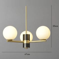 an image of three balls hanging from a ceiling fixture with measurements for the size and width