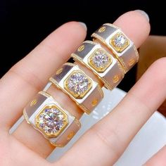 three gold and silver rings with diamonds on them