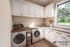 a washer and dryer sitting in a kitchen next to a window