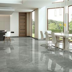 an empty dining room with marble flooring and white chairs