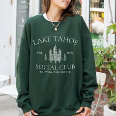 This Camp Bachelorette sweatshirt is the perfect way to gear up for an unforgettable bachelorette experience. It's not just a garment; it's your ticket to a weekend of outdoor fun, laughter, and memories that will last a lifetime. It makes the perfect companion for your camp-themed bachelorette party. Whether you're roasting marshmallows under the stars or embarking on a scenic hike in Lake Tahoe, this cabin crewneck is your go-to choice for celebrating amidst the beauty of nature. Ideal for any situation, a unisex heavy blend crewneck sweatshirt is pure comfort. These garments are made from polyester and cotton. This combination helps designs come out looking fresh and beautiful. The collar is ribbed knit, so it retains its shape even after washing. There are no itchy side seams on these Cabin Girls Trip, Bachelorette Party Lake Weekend, Lake Tahoe Bachelorette Party, Tahoe Bachelorette, Bachelorette Party Lake, Bachelorette Matching, Bachelorette Merch, Themed Bachelorette, Cabin Trip