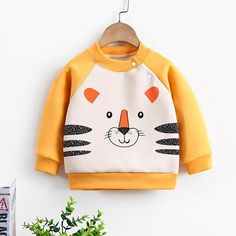 Animal Pattern Fleece-lined Sweatshirt for Toddler Girl - PrettyKid Spring Cartoon Print Sweatshirt, Cute Yellow Long Sleeve Sweatshirt, Spring Cartoon Print Long Sleeve Sweatshirt, Cute Yellow Sweatshirt For Fall, Long Sleeve Cartoon Print Sweater For Spring, White Cartoon Print Outerwear For Fall, White Outerwear With Cartoon Print For Fall, Cute Long Sleeve Fleece Tops, Cute Yellow Long Sleeve Sweater