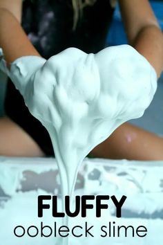 a person pouring white liquid on top of a piece of cake with the words fluffy oobleck slime