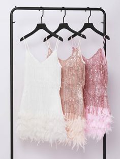 Austyn Tassel Feather Mini Dress In Champagne is destined to make herself known at the most extravagant parties. The ultimate show-stopping, party dress you will stand out wearing her. Adorned in pink fringing and sequins with flat beaded panelling on the waist to accentuate your curves and flatter your figure.   Individually hand embellished with champagne crystal waterfall fringe to create a mesmerising illusion when worn.     Material: 100% polyester    Invisible zipper opening at the back Villanelle Style, Feather Mini Dress, Hoco Inspo, Hollywood Dress, Jumpsuits And Romper, Dress Inspo, Feather Dress, Maxi Dress Green, Embellished Dress