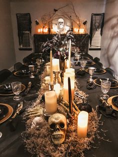 a table with candles and skulls on it