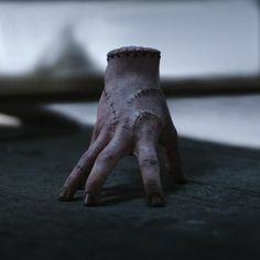 a hand that is sitting on the ground