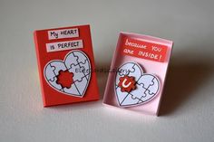 two valentine's day cards in a box with the same heart shaped puzzle piece