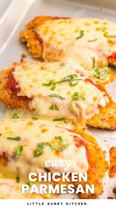 some chicken parmesan is on a baking sheet