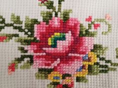 the cross stitch pattern shows a bouquet of flowers