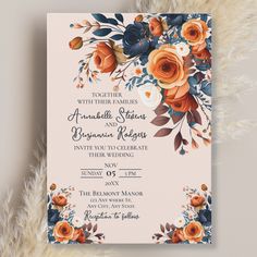 an orange and blue floral wedding card