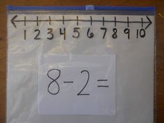 a piece of white paper with numbers on it and an arrow pointing to the left