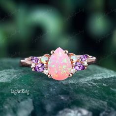 Pear cut Pink opal Engagement ring 14k Rose Gold Promise Ring for her Cluster Bridal Ring Jewelry gifts Women Anniversary Ring Ring Details: - Theme:Romantic Wedding & Engagement - comfortable band - Stone:6*8mm lab created pink opal Side stones: opal & moissanite & amethyst - Total weight: 0.307 ctw (High Quality) - ring band width :1.5mm - ring thicknesses:1.2mm Wedding Band:0.186ct Stones: moissanite & amethyst - ring band width :1.3mm - ring thicknesses:1.2mm - Metal choose:10k or 14k or 18k rose gold / white gold/yellow gold Service: -Completely Handmade -The highest quality in the industry -Money back guarantee -Materials from ethical sources -10 years of business experience -100% genuine -2-3 Week to finish jewelry -Accept customization We believe that our quality, attention to deta Amethyst Ring Band, Gold Service, Rose Gold Promise Ring, Gold Promise Ring, Promise Ring For Her, Opal Engagement Ring, Opal Engagement, Engagement Rings Opal, Promise Rings For Her