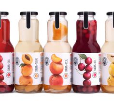 six bottles of fruit juice are lined up