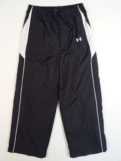 Free Shipping Within The USA!!! UNDER ARMOUR ALL SEASON GEAR MESH LINED FOOTBALL TRACK PANTS Under Armour All Season Gear Mesh Lined Football Track Pants, Youth Boy's Sizes, Brand New with Tags Attached. These Fabulous Track Pants are Black & White in color with White details. Features and Details Include: - BRAND: UNDER ARMOUR - FOOTBALL - STYLE: TRACK PANTS - STYLE #: 1102328 - COLOR: BLACK/WHITE - UNDER ARMOUR ALL SEASON GEAR - Elastic Waist with Interior Drawstring - (2) Zippered Hand Pocket Under Armour Black Cotton Bottoms, Under Armour Black Pants With Pockets, Under Armour Black Pants With Elastic Waistband, Under Armour Logo, White Details, Pants Style, White Mesh, Trim Detail, Fashion Pants