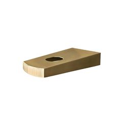 a gold colored toilet paper holder with a hole in the middle