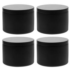 four black round plastic containers with lids