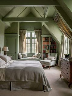 a bedroom with green walls and carpeted flooring