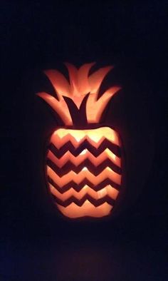 a carved pumpkin shaped like a pineapple