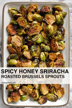 roasted brussel sprouts with spicy honey sriraca in a white dish