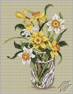 a vase filled with yellow and white flowers