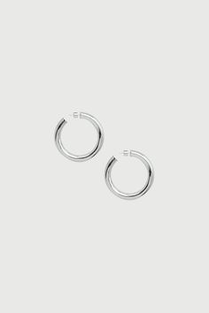 Any outfit, every day, all occasions. Sculpted in a two-inch arc, our sterling silver hoops are the style that unites true hoop girls and those who just dabble in the art. Wear solo or alongside other hoops in a graduating stack. Jewelry Collection Handcrafted in Brazil Sterling Silver over Brass Thickness: 7mm Diameter: 2" Weight: 0.55 oz Waterproof Hypoallergenic Stack Jewelry, Naked Wardrobe, The Medium, Sterling Silver Hoop Earrings, Sterling Silver Hoops, Womens Size Chart, Silver Hoops, Silver Hoop Earrings, Brazil