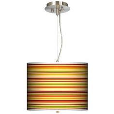 a multicolored lamp shade hanging from a ceiling fixture with a white cord attached to it