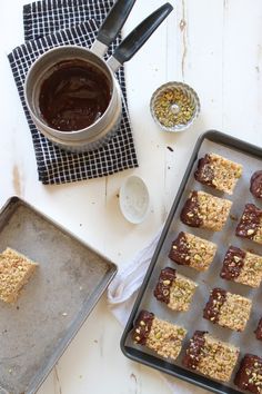 some food is laying out on a baking sheet and next to a cup of coffee