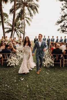 a newly married couple walking down the aisle