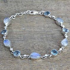 Rainbow moonstone and blue topaz link bracelet, 'Misty Sky' - Blue Topaz and Rainbow Moonstone Gemstone Station Bracelet Station Bracelet, Gems Bracelet, Topaz Color, Moonstone Bracelet, Sky Blue Topaz, Unique Bracelets, Amethyst Bracelet, Fancy Jewelry, Blue Jewelry