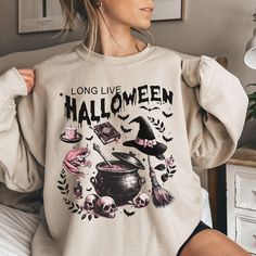 Our halloween sweatshirt is the perfect wear for the fall season and the Halloween party! -These sweatshirts are Unisex Adult Sizing (not women's fitted sweatshirt ). If you're going for a more fitted look, we suggest to size down.Please use the measurements chart in the pictures section to determine your correct size. -Props used In photos  are NOT included with purchase. -Care Instructions: Wash inside out in cold water, gentle cycle, tumble dry low or let air dry. Do not iron on design. If you have any questions, please contact me and I will be happy to answer. Please note that due to lighting effects, monitor's brightness, contrast and other settings, there might be some slight differences in the color tone/shade of the website's photo and the actual item. Thank you for visiting! Spooky Long Sleeve T-shirt For Winter, Halloween Crew Neck Sweater, Spooky Halloween Crew Neck Sweater, Halloween Long Sleeve Streetwear Sweater, Spooky Oversized Halloween Sweatshirt, Oversized Spooky Halloween Sweatshirt, Oversized Long Sleeve Halloween T-shirt, Oversized Long Sleeve T-shirt For Halloween, Halloween Graphic Print Sweatshirt