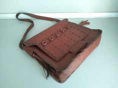 Vintage genuine leather bag - Retro leather bag - Old leather bag from 70' - brown leather bag - Old Genuine Leather Bag - Shoulder bag Beautiful shoulder bag made of genuine leather . For people who love items with history . Dimensions : Height without the handle - 25 cm x 23 cm x 6,5 cm For other GENUINE LEATHER BAG please check here : https://www.etsy.com/shop/TheVINTAGEShopBG?ref=l2-shopheader-name&section_id=22456024 All pictures are real . You buy exactly what you see in the photos . T Medium Leather Satchel, Brown Leather Flap Bag With Leather Backing, Vintage Brown Soft Leather Rectangular Bag, Brown Soft Leather Rectangular Flap Bag, Leather Flap Bag With Leather Backing, Rectangular Leather Flap Bag With Leather Backing, Rectangular Brown Shoulder Bag With Leather Backing, Vintage Brown Rectangular Shoulder Bag In Soft Leather, Vintage Brown Leather Satchel Bag