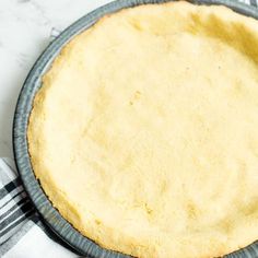 an uncooked pie sitting on top of a table