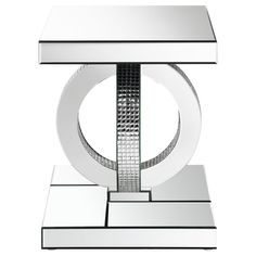 a modern glass and chrome table with an abstract design