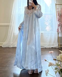 - Beautiful soft blue matching set includes sheer frosted blue maxi slip dress featuring sheer lace with floral embroidery at bustier on a sakura embossed fabricThe robes features matching lace embroidery on cuffs and collar- robe belt included; pockets on robes-size M-pristine condition with no visible flaws 🤍Model Measurements: - Bust: 34B - Waist: 26 - Hip: 38 - Height: 5"4 🤍 Size of mannequin: size 2 - 4 Blue Long Sleeve Lace Gown, Blue Lace Gown For Spring, Spring Blue Lace Gown, Spring Evening Lace Sleepwear, Blue Lace Nightgown With Lace Trim, Lace Gown For Daywear, Spring Wedding Night Gown With Lace Trim, Blue Lace Nightgown For Loungewear, Night Gown Dress