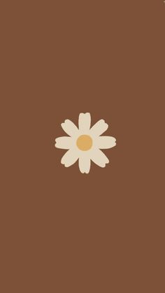 a brown background with a white flower on the center and two yellow dots in the middle