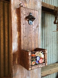 an old door with a basket hanging from it's side and the words handmade next to it