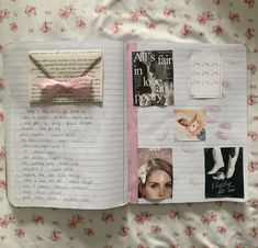 an open book with pictures and writing on it, sitting on a bed covered in pink flowers