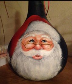 there is a vase with a santa clause painted on it