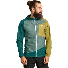 When we're hiking on an early spring day and need to be prepared for bad weather, we bring along the lightweight, easy-to-pack Ortovox Windbreaker Jacket. Made with a mixture of TEC-Stretch fabric and merino wool, we are protected from the wind and rain without any sacrifice in breathability. The hem and hood are both self-adjusting to provide a perfect ergonomic fit, and when the sun comes out, we easily pack up the jacket into its own chest pocket for easy carry in our pack. Green Nylon Windbreaker For Outdoor, Sporty Green Windbreaker For Outdoor Work, Green Sporty Windbreaker For Outdoor Work, Sporty Green Windbreaker For Hiking, Sporty Green Outerwear For Outdoor Work, Functional Nylon Outerwear For Trail Running, Functional Ripstop Windbreaker For Hiking, Green Nylon Hiking Outerwear, Practical Nylon Windbreaker For Hiking